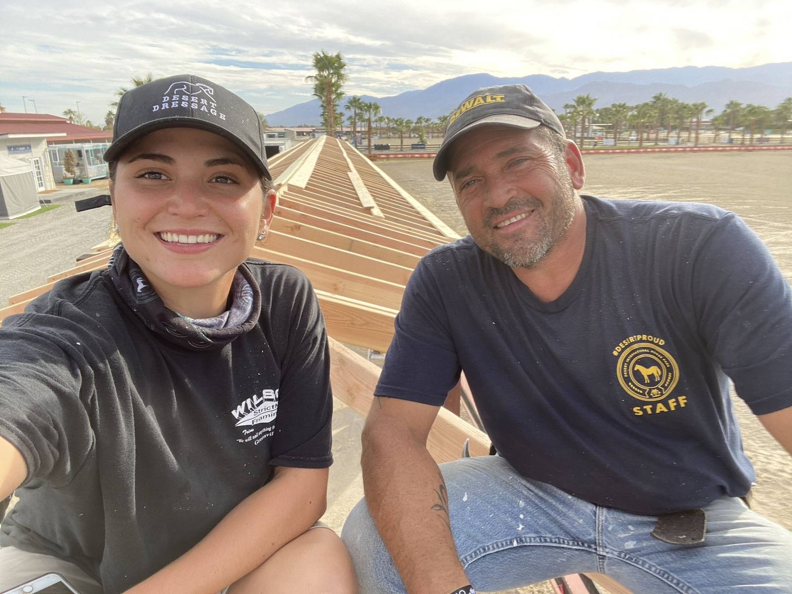 Two Wilson's crew members on site wearing branded gear