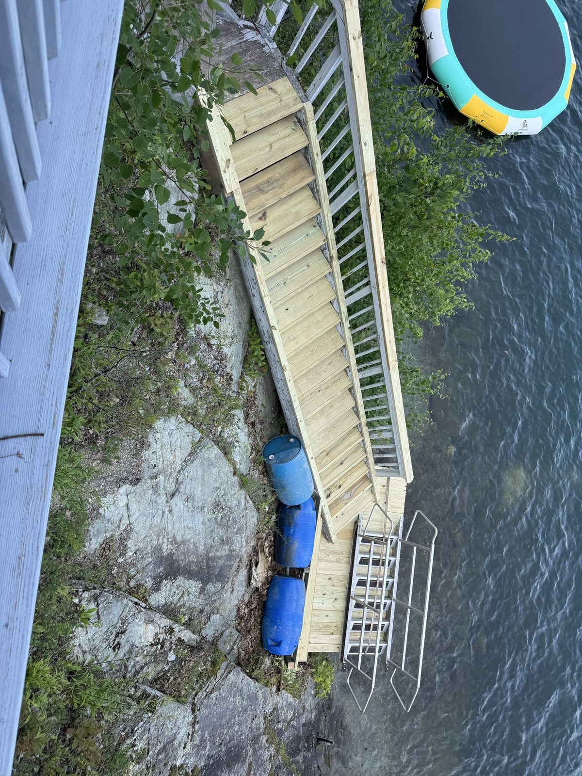 Aerial view of new pressure-treated stairs and landing leading down to the lake